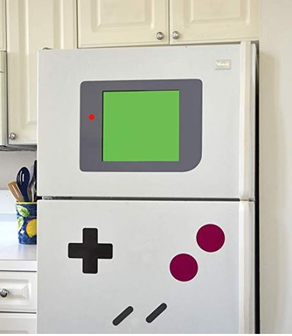 مغناطيس للثلاجة ولوح للكتابة على شكل لعبة إلكترونية